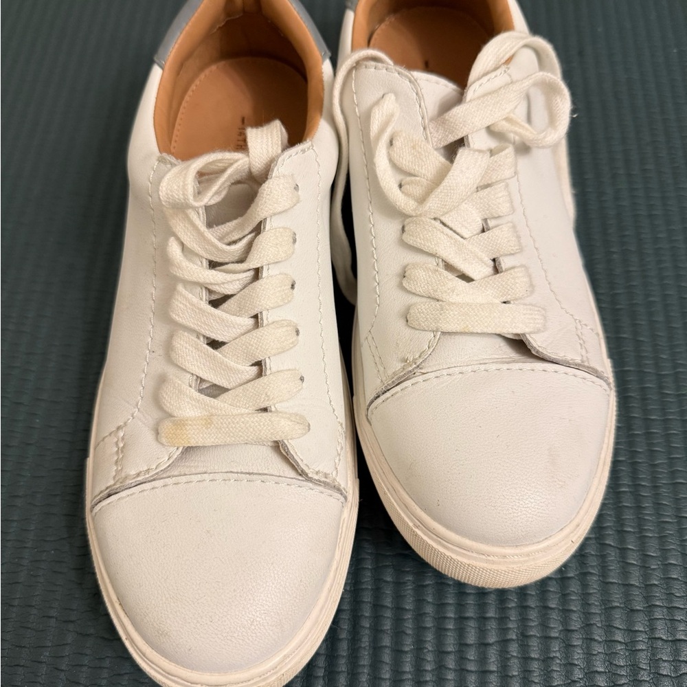 Size 8.5 white shoes. 14th and Union.